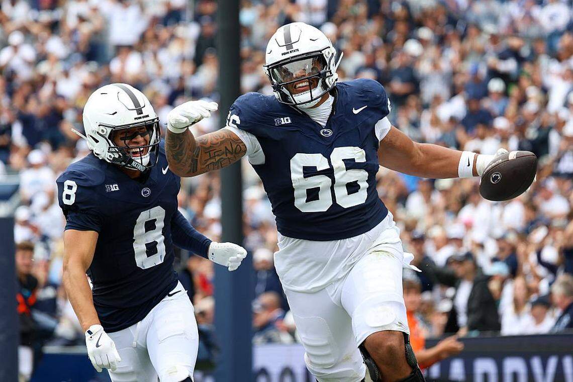 STATE COLLEGE, PENNSYLVANIA - SEPTEMBER 6: Drew Shelton #66 of the Penn State Nittany Lions reacts with Trebor Peña #8 of the Penn State Nittany Lions after a play against the FIU Panthers at Beaver Stadium on September 6, 2025 in State College, Pennsylvania. (Photo by Isaiah Vazquez/Getty Images)