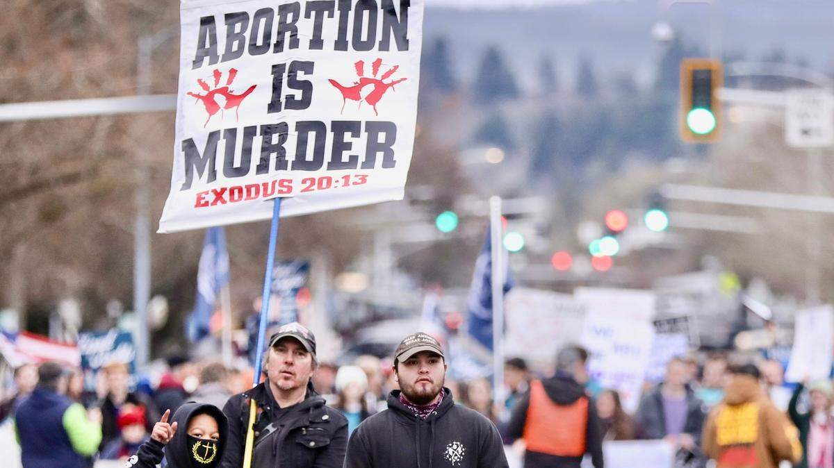 People opposing abortion walk in the Oregon March for Life on Saturday, Jan. 28, 2023 at the Oregon State Capitol in Salem, Ore. 