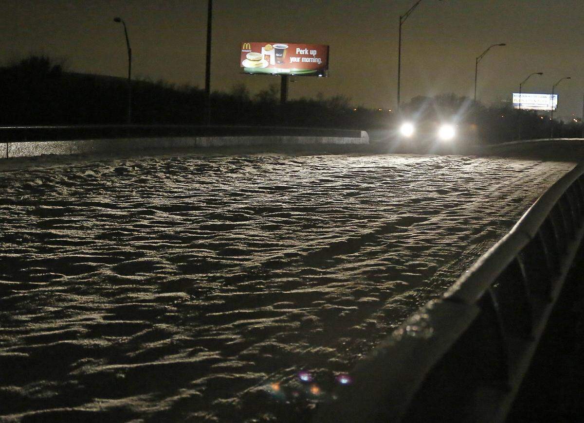 Cobblestone ice on bridges and overpasses makes travel treacherous on Saturday, Dec. 7, 2013, in Haltom City.