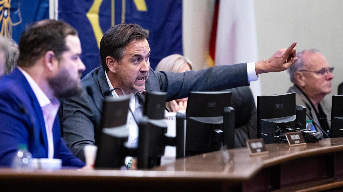 Keller ISD President Charles Randklev gets in heated debate with the event attendees during a special meeting regarding the possible split of the Keller Independent School District at the Keller ISD Education Center in Keller on Thursday, Jan. 16, 2025.