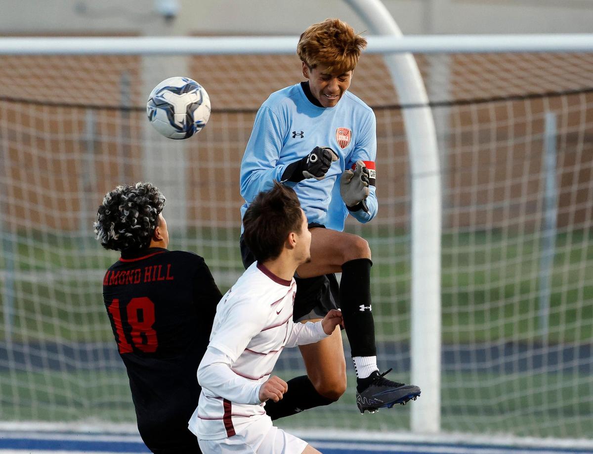Bridgeport’s David Kranz undercuts Diamond Hill-Jarvis’ keeper Reyes Medina during a UIL Class 4A Regional Quarterfinal soccer game at Kangaroo Stadium in Weatherford Texas, Tuesday Apr 02, 2024. Diamond Hill led 2-0 at the half.