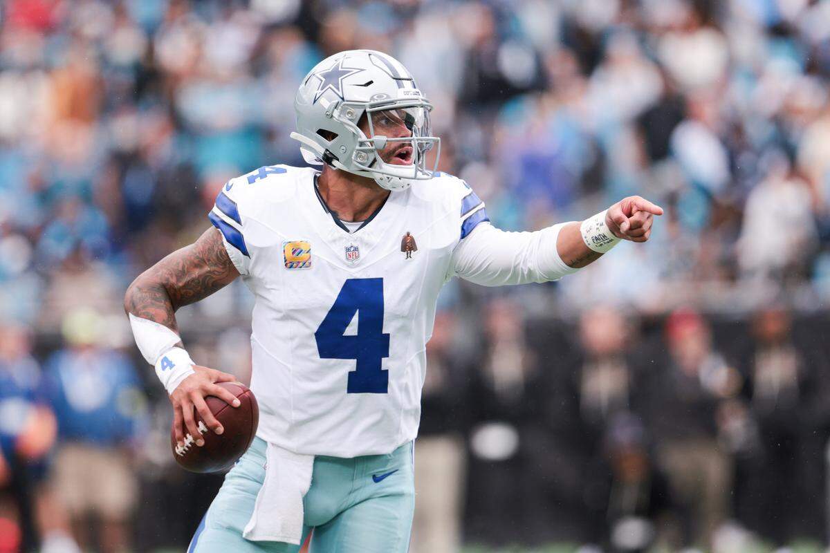 Oct 12, 2025; Charlotte, North Carolina, USA; Dallas Cowboys quarterback Dak Prescott (4) communicates during the second half against the Carolina Panthers at Bank of America Stadium. Mandatory Credit: Scott Kinser-Imagn Images