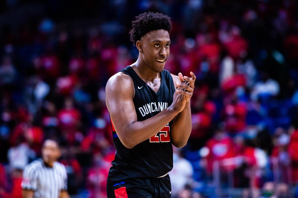 Damon Nicholas (25) celebrates on the court with little time left for Westlake to make a comeback during the 6A state final between Duncanville and Austin Westlake at the Alamodome in San Antonio Texas, on March 13, 2021. Duncanville went on to win 66-53. (Photo by Matt Smith. Special to the Star-Telegram).