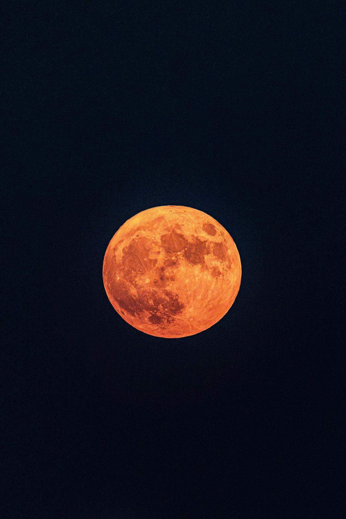 The Super Blue Moon rises over the Summit Office Park Plaza near downtown Fort Worth on Wednesday, Aug. 30, 2023.