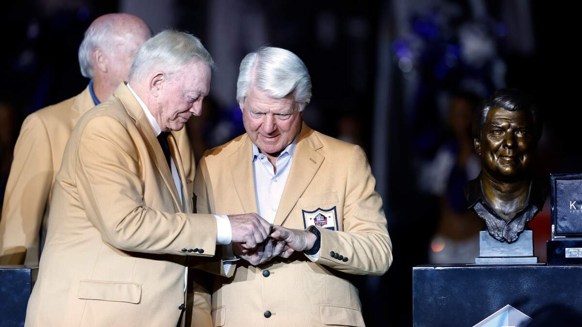 Dallas Cowboys team owner Jerry Jones honors former coach Jimmy Johnson for his Hall of Fame induction during the halftime ceremony of Monday night’s game at AT&T Stadium. (AP Photo/Ron Jenkins)