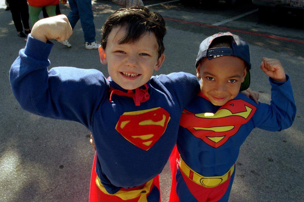 1997: Having shown up in similar outfits, Trey Ewing (left), 5, and schoolmate Nicholas Murphy, 3, proudly proclaim their own muscles to be the biggest following the Trinity Children’s Center Halloween parade. The school is part of Trinity Lutheran Church in west Fort Worth.