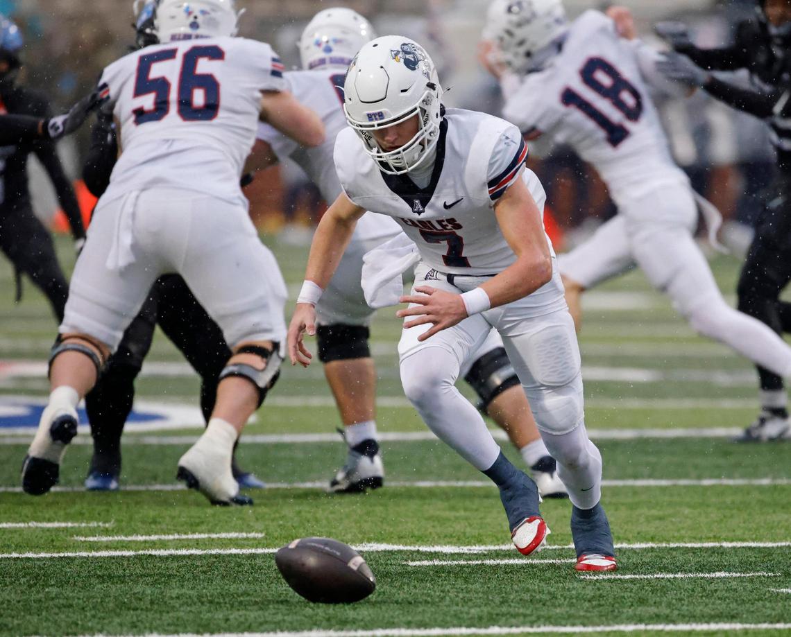 Allen quarterback Brady Bricker (7) chases a mishandled snap during the UIL 6A D1 Quarterfinals at Vernon Newsom Stadium in Mansfield, Texas, Saturday, Dec. 07, 2024.