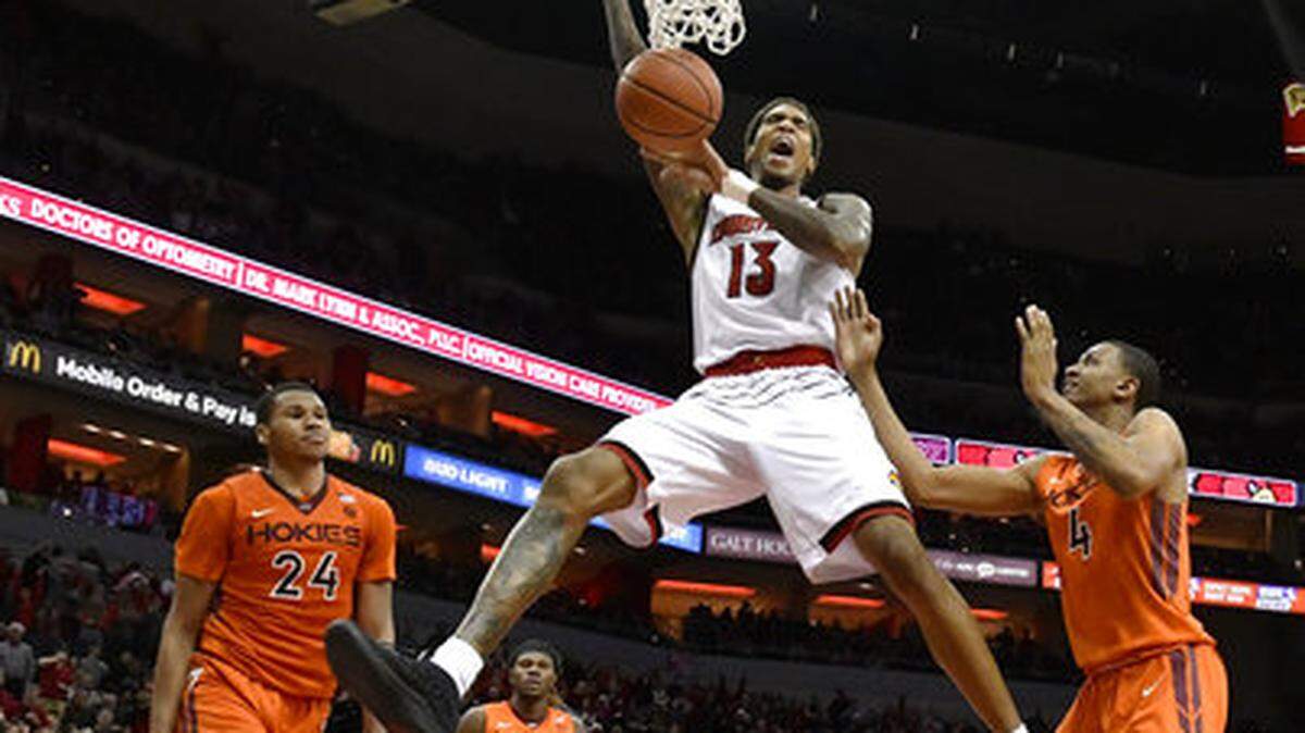 Louisville forward Ray Spalding (13) dunks between the defense of Virginia Tech. Spalding just signed with the Mavs. (AP Photo/Timothy D. Easley)