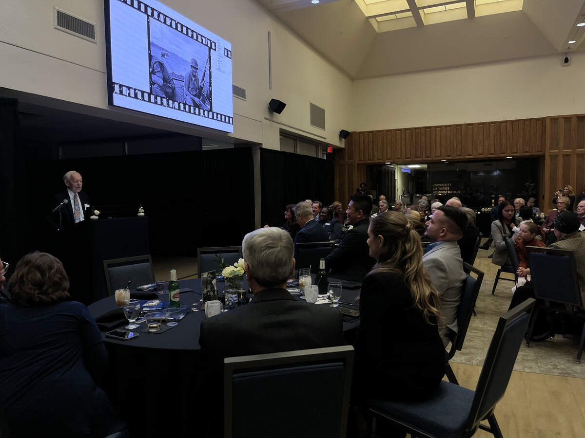 Legendary journalist Bob Schieffer spoke to friends and family at an event celebrating the new UT Arlington exhibit showcasing photos he took during the Vietnam War for the Fort Worth Star-Telegram.