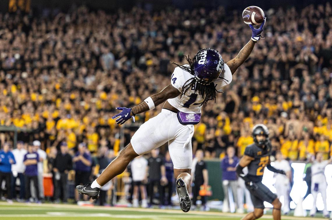 TCU wide receiver Jordyn Bailey (14) jumps to catch a touchdown pass in the first half of an NCAA football game between TCU and Baylor at McLane Stadium in Waco on Saturday, Nov. 2, 2024.