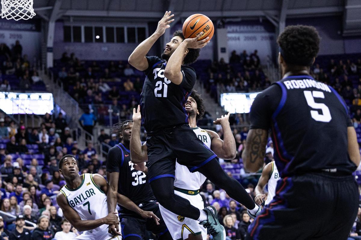 TCU guard Noah Reynolds (21) goes up for a contested layup in the second half of an NCAA game between TCU and Baylor at Schollmaier Arena in Fort Worth on Tuesday, March 4, 2025.