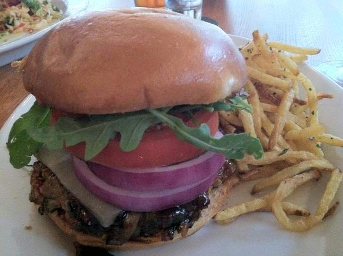 The veggie burger at Pacific Table is made with sticky sushi rice, shiitake mushrooms, carrots and oats, and finished with a pineapple glaze.