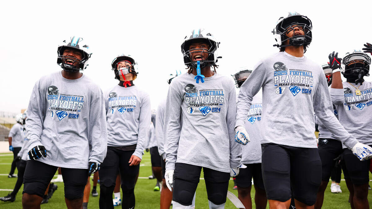 North Crowley players scream toward the Coppell side of the field during pregame warmups before a Class 6A Division I regional playoff Saturday, Nov. 29, 2025, at Midlothian ISD Stadium in Midlothian.