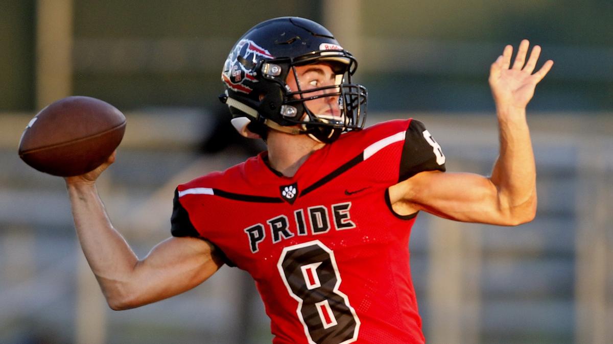 Colleyville Heritage quarterback Collin Losack throws downfield against North Forney on Friday at Dragon Stadium. Colleyville Heritage won 16-0.