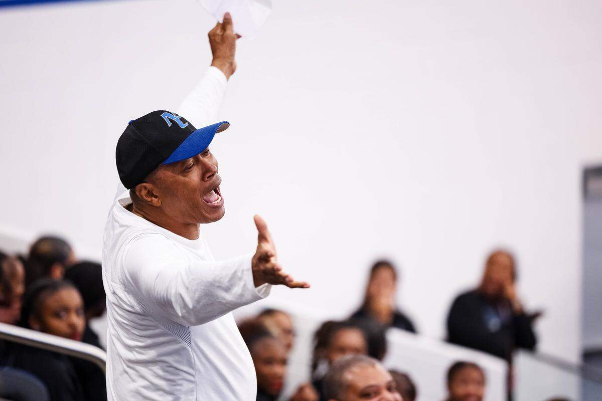 North Crowley super fan George Shelton holds his hands out in a cheer toward the crowd after a timeout in a District 3-6A matchup against Weatherford on Feb. 6 at North Crowley.
