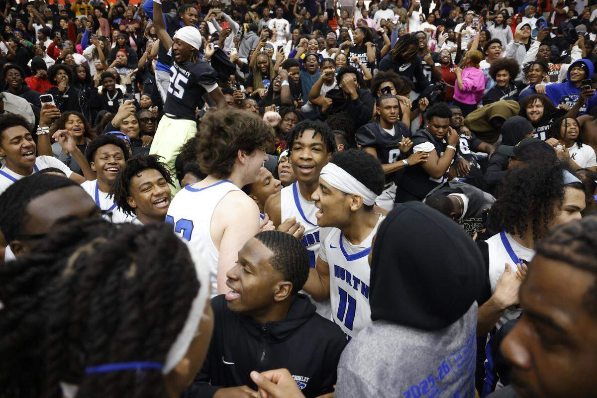 North Crowley players celebrate with fans after their win against Duncanville in a Class 6A Division I state semifinal Tuesday at Wilkerson-Greines Activity Center in Fort Worth.