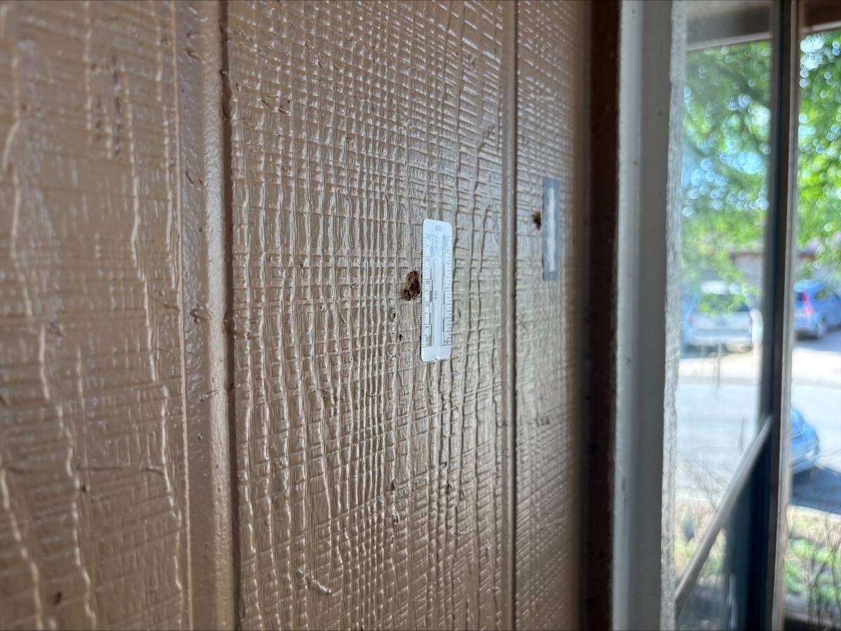 Bullet holes near a door in James Washington’s Fort Worth home after a drive-by shooting at the house early on April 2, 2026.