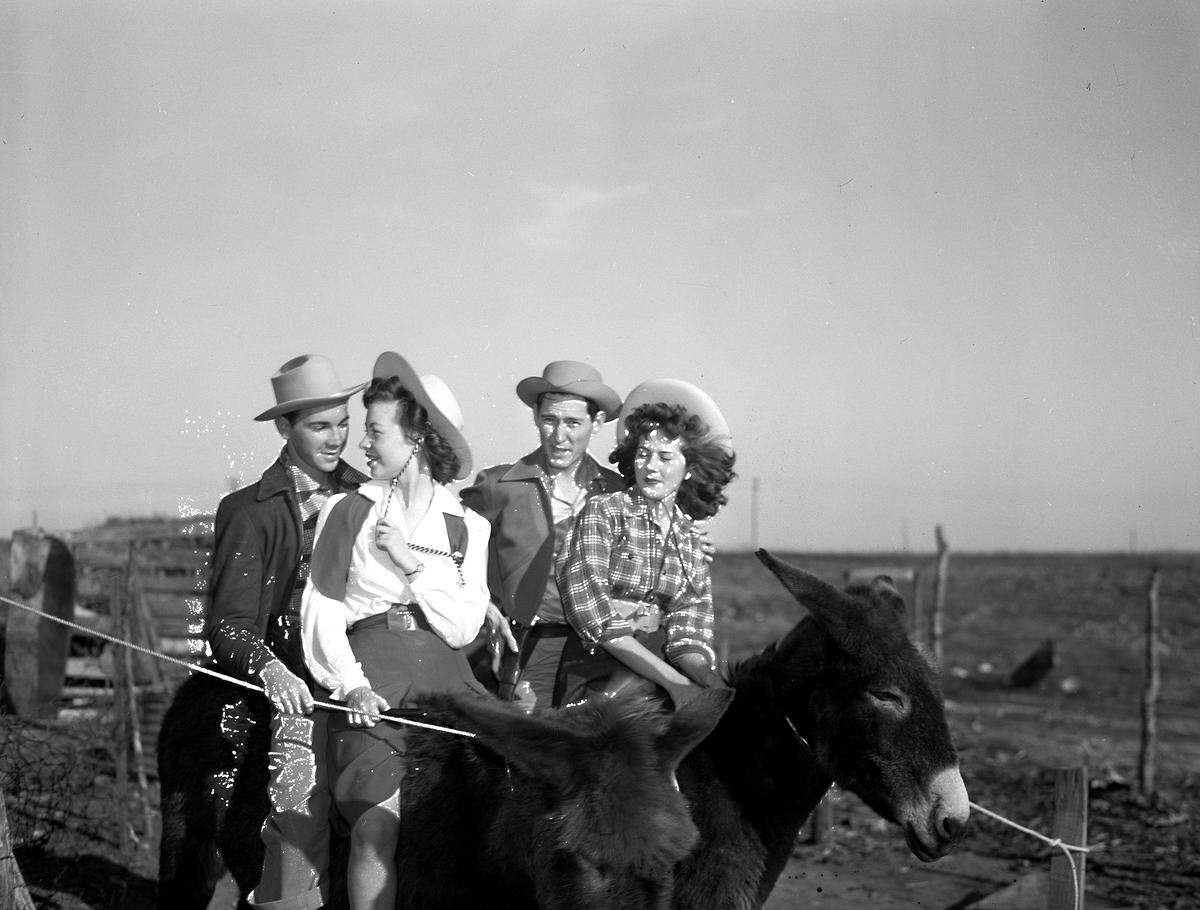 Feb. 5, 1942: “With plans to enter a donkey race Saturday afternoon, one of the highlights of TCU’s fourth annual Ranch Week, these students tuned up their mounts in trial spins. Left to right, Vance Gorman, Big Sandy; Tomasine Stanley, San Angelo; Bill Boren, Memphis, Texas; and Betty Beckham, Plano.