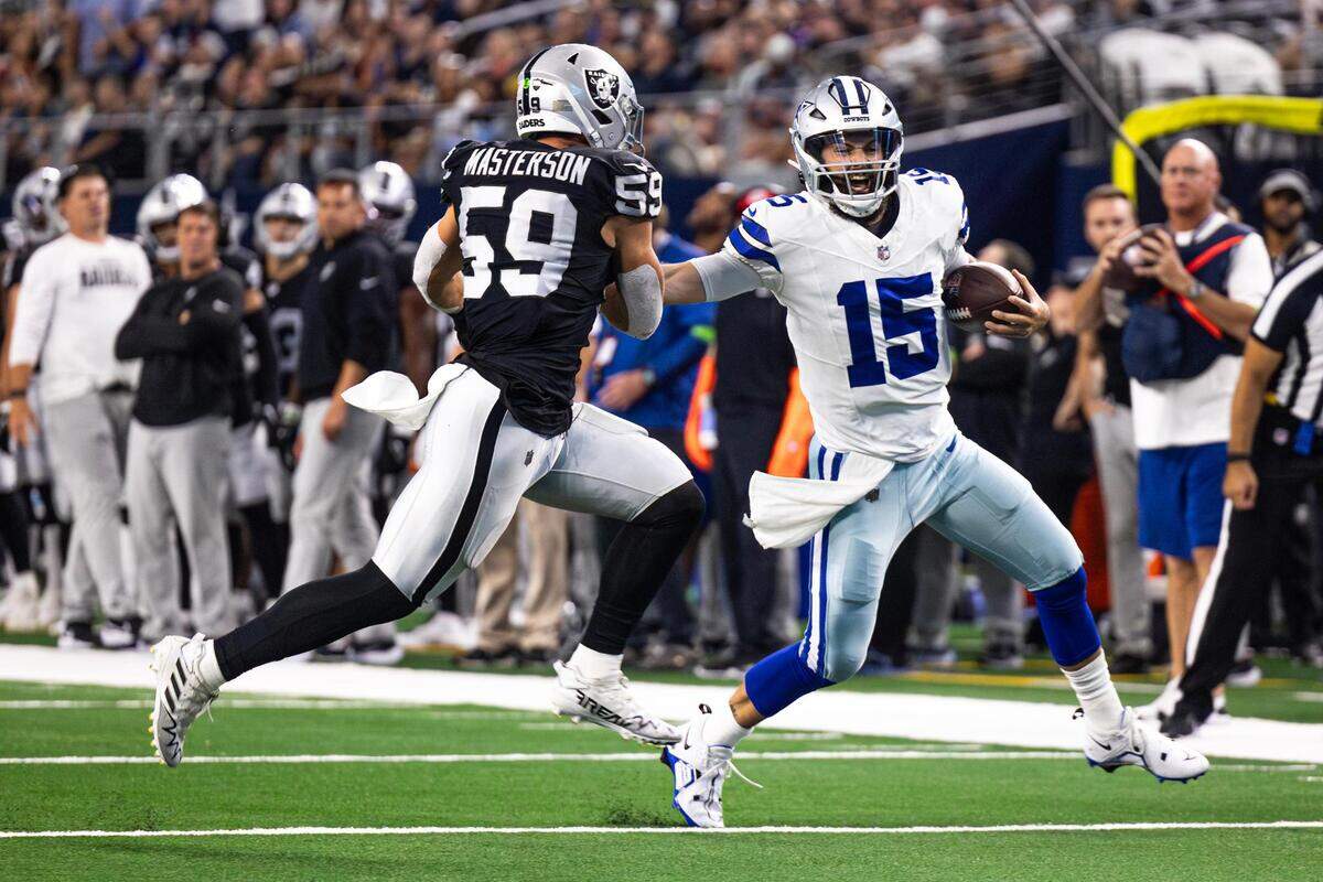 Dallas Cowboys quarterback Will Grier (15) stiff arms Las Vegas Raiders defender Luke Masterson (59) in the first half of a preseason game against the Las Vegas Raiders at AT&T Stadium in Arlington, Texas on Saturday, Aug. 26, 2023.