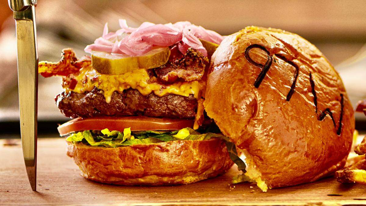 The 97 West burger is a bacon-pimiento cheeseburger.