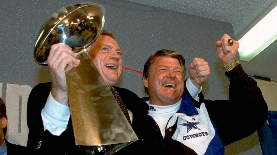 Happy times: Dallas Cowboys head coach Jimmy Johnson, right, celebrates with owner Jerry Jones who holds up the Vince Lombardi Trophy after their win over the Buffalo Bills in NFL football’s Super Bowl XXVII in Pasadena, Calif. Johnson said he’d love to see the Cowboys in the Super Bowl this February in Arizona.