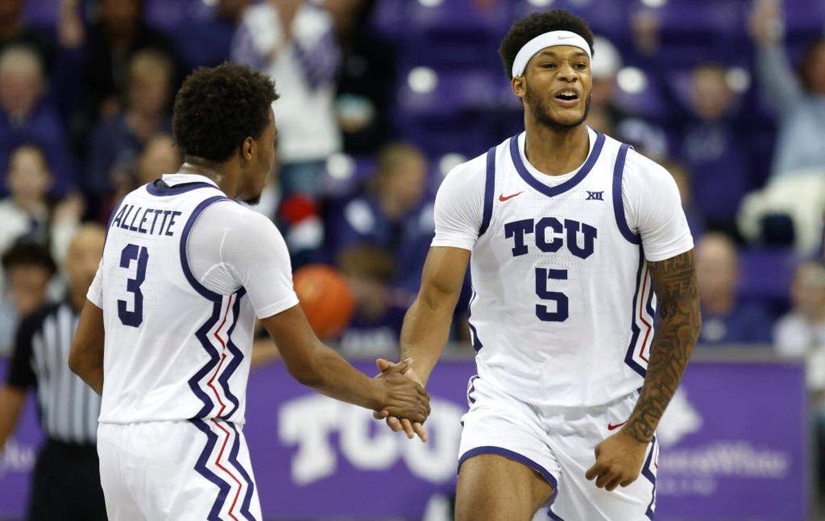 FORT WORTH, TX - NOVEMBER 8: Micah Robinson #5 and Vasean Allette #3 of the TCU Horned Frogs celebrate as TCU takes on the Florida Gulf Coast Eagles in the second half at Schollmaier Arena on November 8, 2024 in Fort Worth, Texas. (Photo by Ron Jenkins/Getty Images)