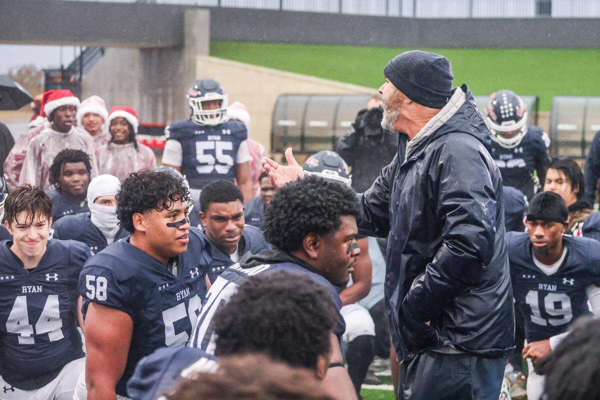 Denton Ryan head coach Dave Henigan talks to his team after the Raiders beat Aledo 31-21 in a Class 5A Division 1 state quarterfinal on Saturday, Dec. 7, 2024 at Crowley ISD Multi-Purpose Stadium in Fort Worth, Texas.