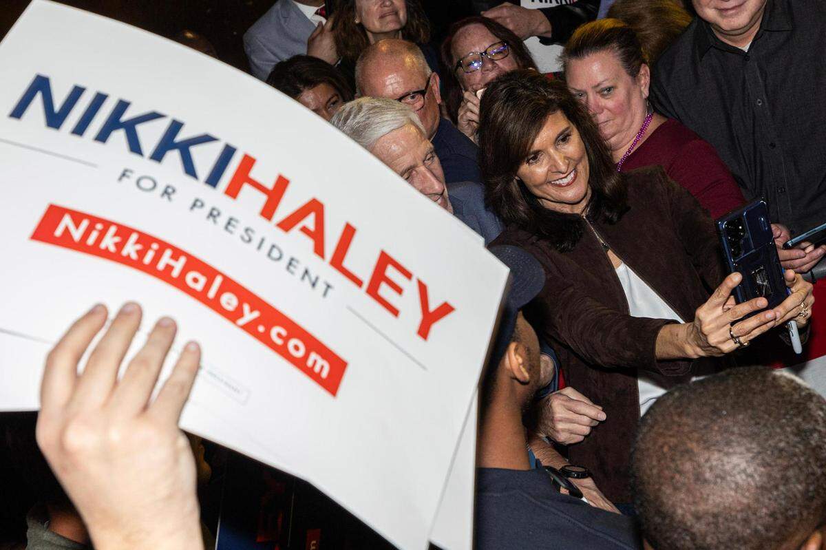 Republican presidential candidate Nikki Haley takes photos with her supporters at her presidential campaign rally at the Southside Music Hall in Dallas on Thursday, Feb. 15, 2024.