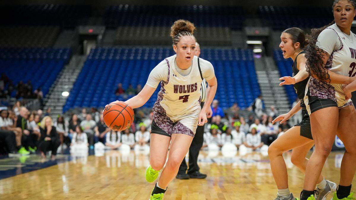 Mansfield Timberview’s Brooklyn Terry (4) drives around a screen set by teammate Emilee Jones (32) against Cedar Park in a Class 5A state semifinal on Thursday, February 29, 2024 at the Alamodome in San Antonio, Texas. Timberview defeated Cedar Park 67-45.