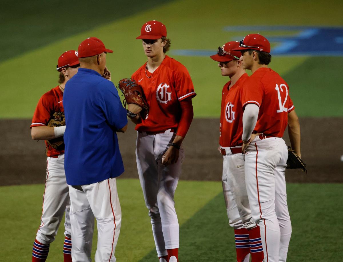 Grapevine head coach Jimmy Webster talks to his pitcher Dasan Hill during game 2 of a UIL Conference 5A Regional final baseball game at Nathan F. Sanford Field at L.D. Bell in Hurst, Texas, Friday May 31, 2024.
