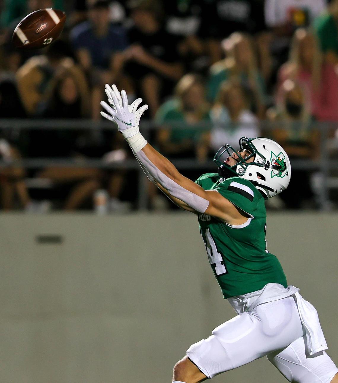 Southlake Carroll receiver Brady Boyd (14) reaches for a pass against Rockwall Heath during the first half of a High School Football game, Friday night, October 2, 2020 played at Dragon Stadium in Southlake, TX. (Steve Nurenberg Special to the Star-Telgram)