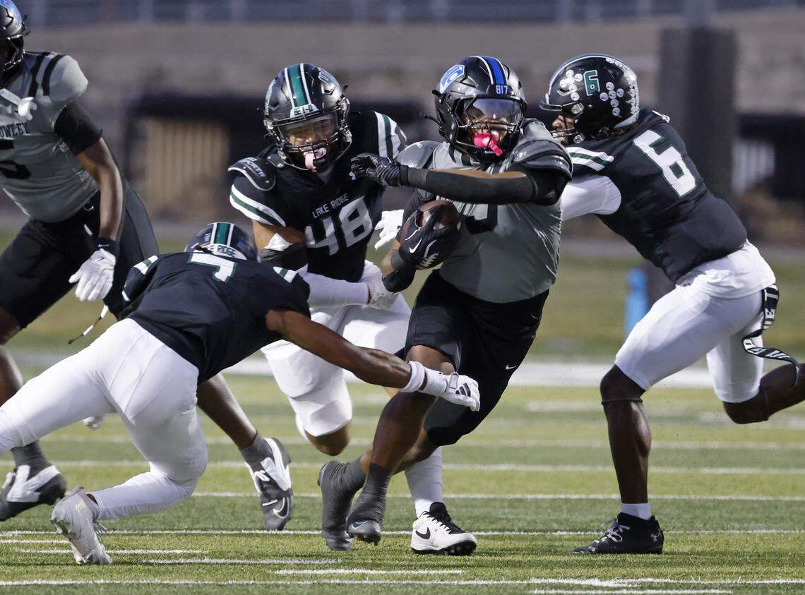 North Crowley running back G’Yrell Smith (3) runs through the Eagle defense during the first half of a UIL football game between North Crowley and Lake Ridge at Vernon Newsom Stadium in Mansfield, Texas, Thursday, October 09, 2025.
