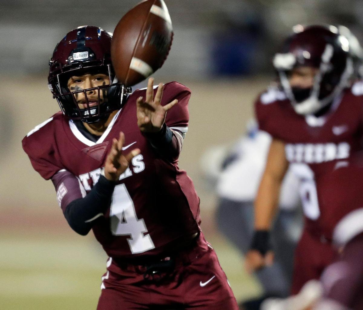 North Side quarterback Isaak Rosales (4) pitches the ball out to his running back on an option during a high school football game at Farrington Field in Fort Worth Texas, Friday, Oct. 30, 2020. North Side defeated O.D. Wyatt 43-26. (Special to the Star-Telegram Bob Booth)