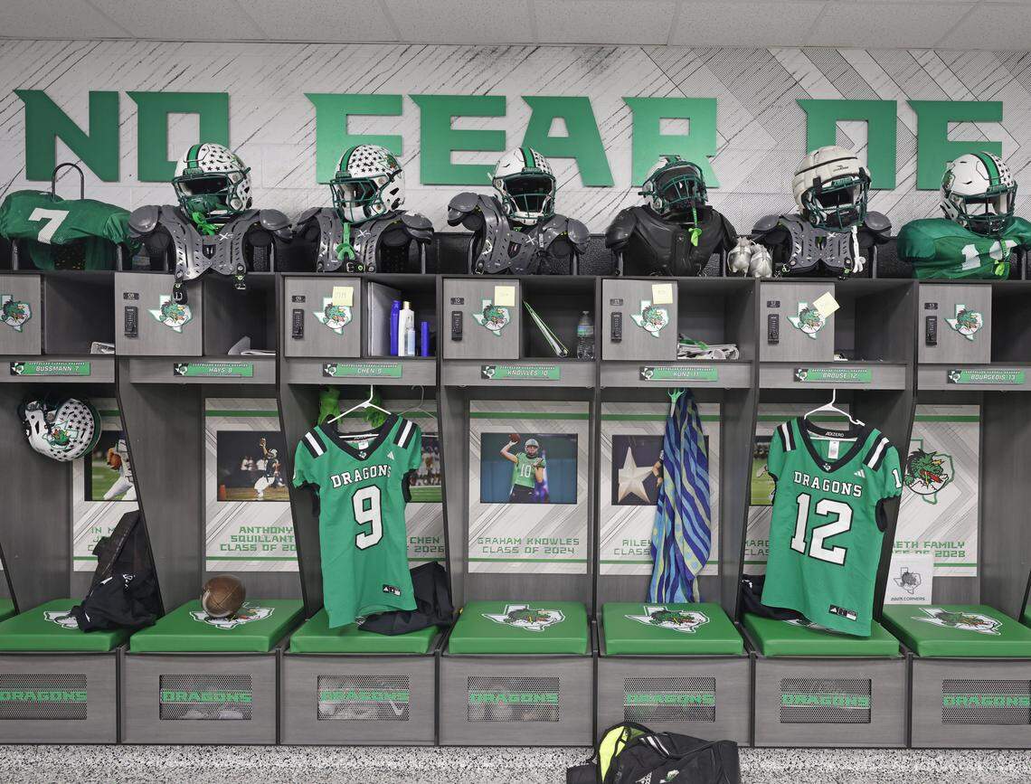 Open lockers contain football jerseys, pads and helmets.