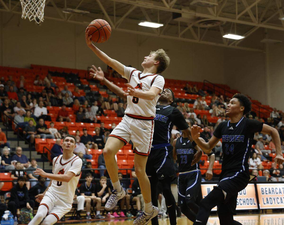 Aledo guard Braxton Hamric (5) lays one up against Brewer during the first half of a UIL boys basketball game at Aledo High School in Aledo, Texas, Friday Feb. 13, 2026.