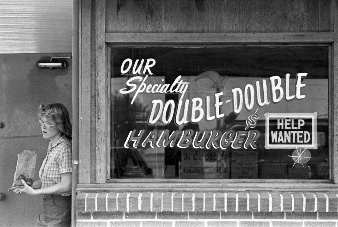 Oct. 5, 1983: At Al’s Drive-In restaurant in Arlington, Missy Freede delivers a bag of burgers alongside an advertisement painted in the store’s window for the restaurant’s specialty of the Double-Double Hamburger next to a “Help Wanted” sign taped to the window. The location, 2121 N. Collins St., is now a Wal-Mart Neighborhood Market. The restaurant has moved twice and is now at 1276 N. Fielder Road.