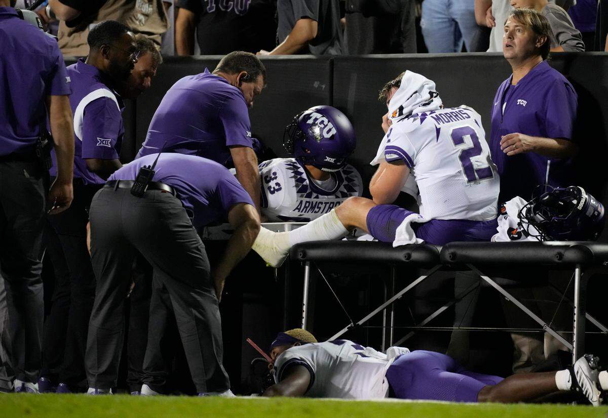 TCU quarterback Chandler Morris, right, is attended to by trainers after being injured against Colorado on Sept. 2, 2022, in Boulder, Colo.