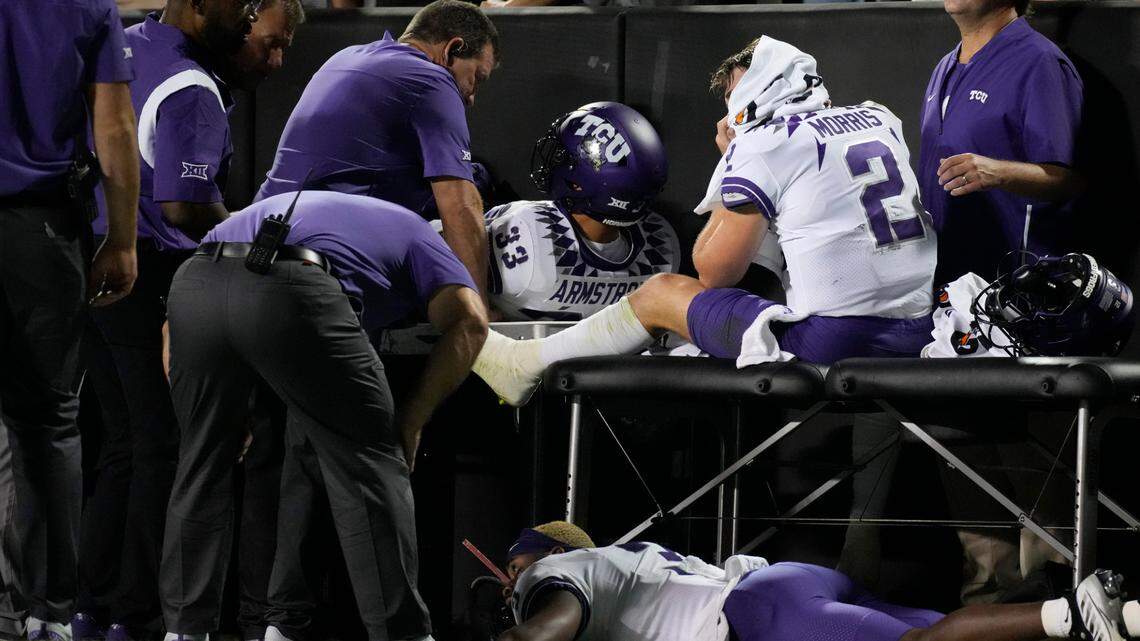 TCU quarterback Chandler Morris, right, is attended to by trainers after being injured while throwing a pass in the second half of an NCAA college football game against Colorado Friday, Sept. 2, 2022, in Boulder, Colo. (AP Photo/David Zalubowski)