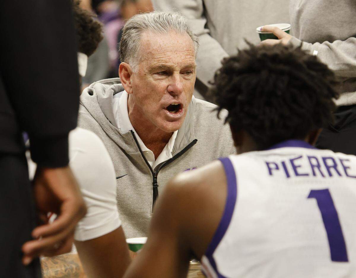 TCU head coach Jamie Dixon talks to the team during a time out during the second half of a NCAA basketball game between New Orleans University and TCU at Schollmaier Arena in Fort Worth, Texas, Monday Nov. 03, 2025. The Horned Frogs dropped their home opener 78-74 to the Privateers.