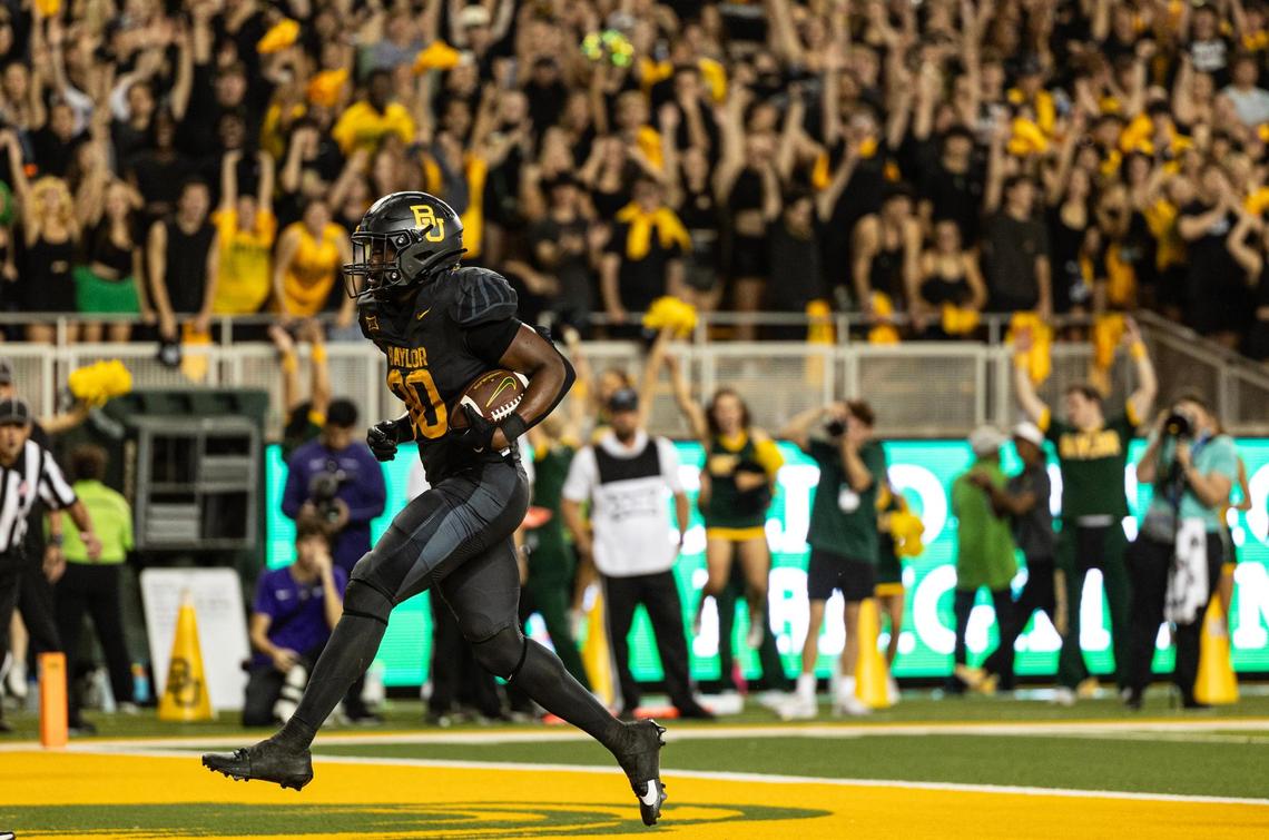 Baylor running back Bryson Washington (30) rushes in for his fourth touchdown of the game in the second half of an NCAA football game between TCU and Baylor at McLane Stadium in Waco on Saturday, Nov. 2, 2024.