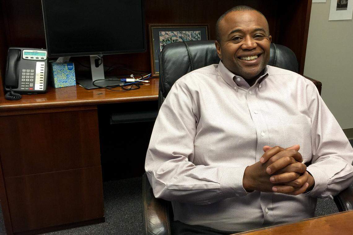 Abilene Mayor Anthony Williams talks with a visitor about immigration issues in his city.