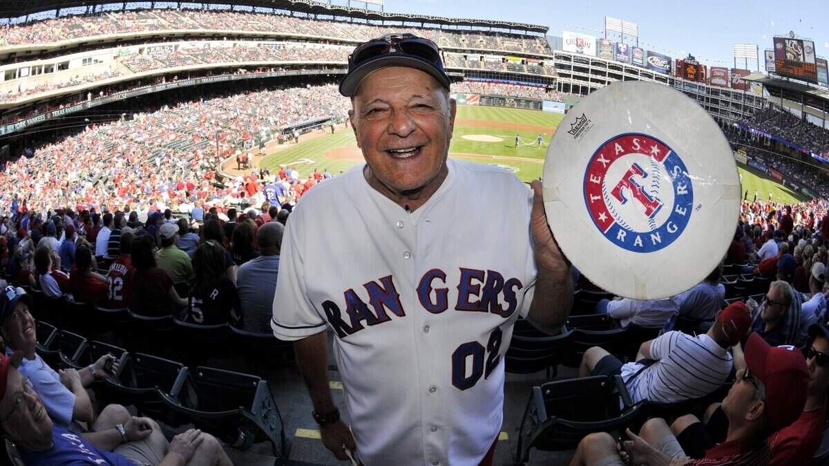In this file photo, John “Zonk” Lanzillo Jr. helps fire up Texas Rangers fans for Game 2 of the ALCS against the New York Yankees on Oct. 16, 2010 in Arlington. Lanzillo died Wednesday at age 88.