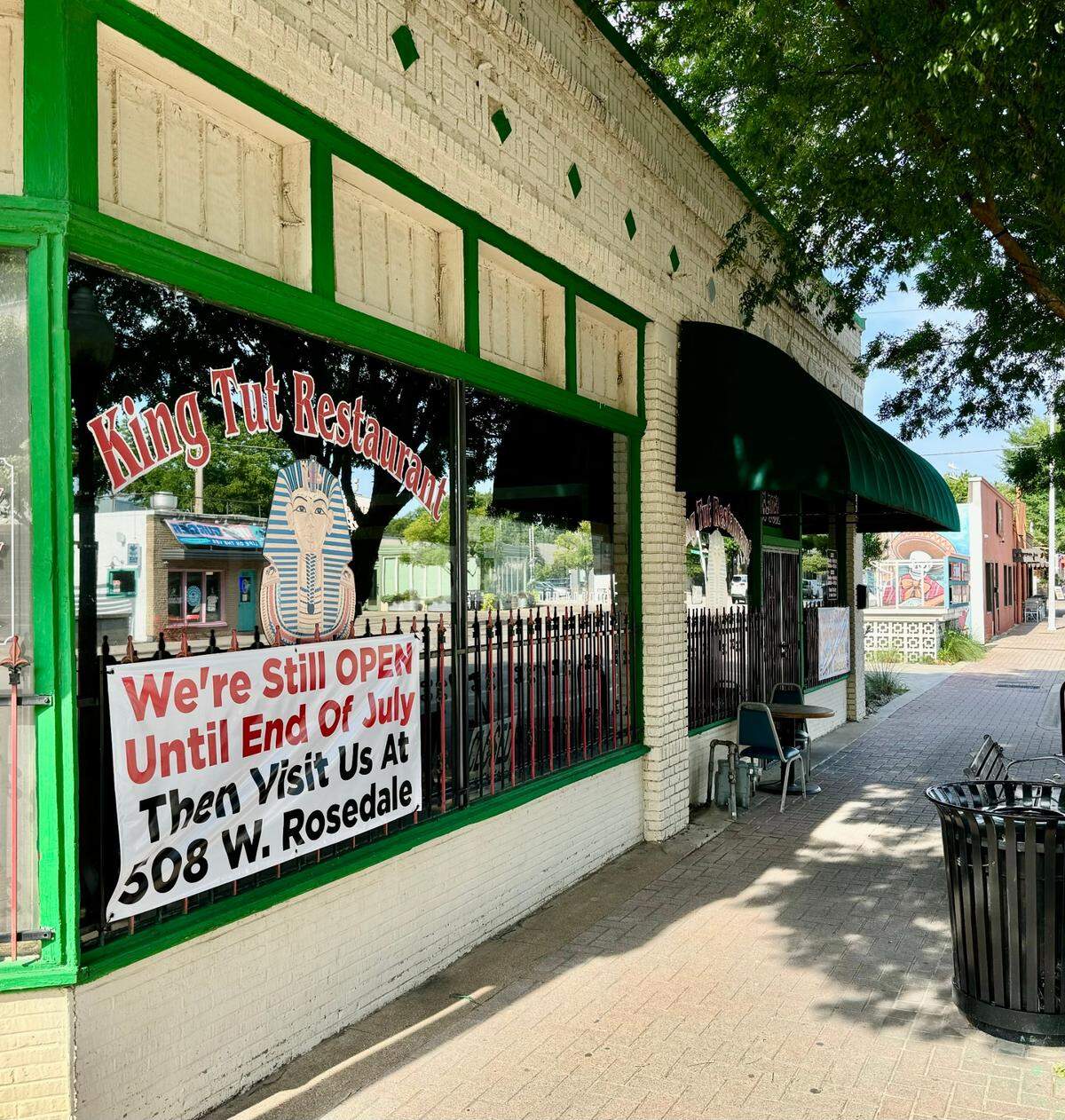 A sign outside King Tut Restaurant June 9, 2024, announces the new location in the Hemphill Crossing shopping center.