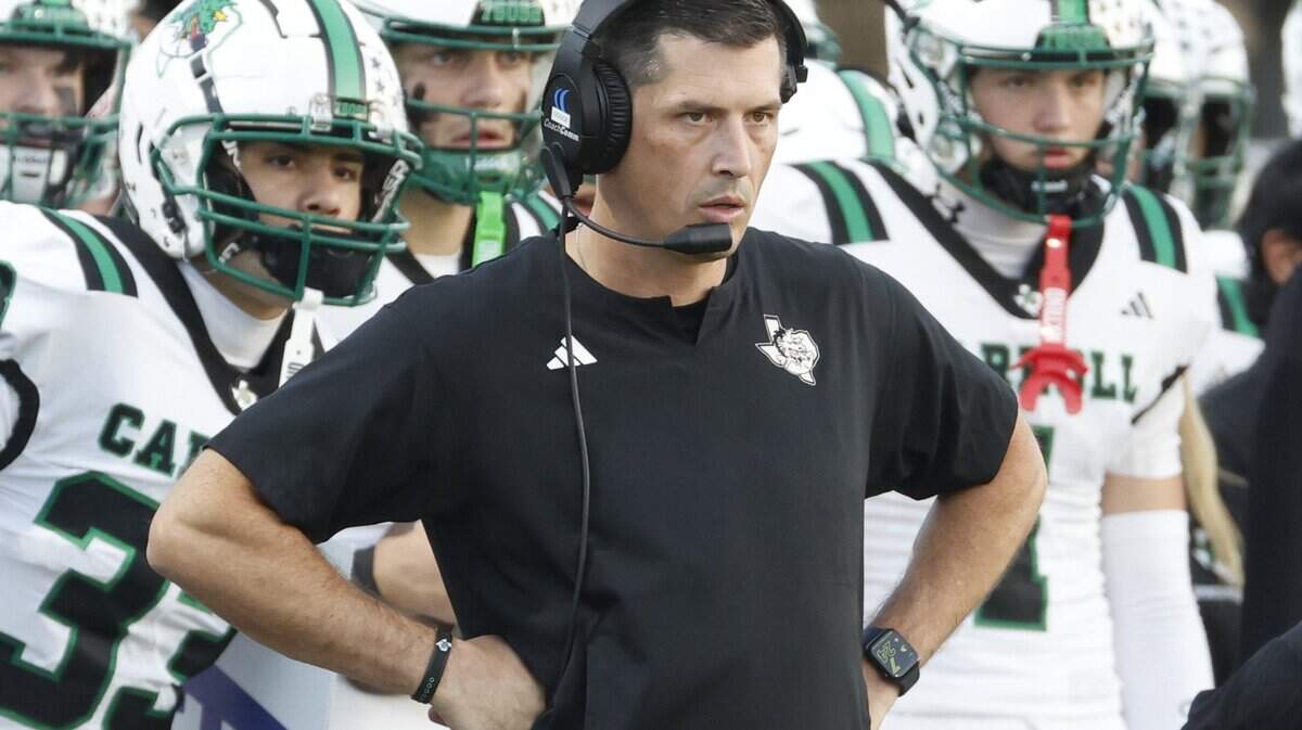 Southlake head coach Riley Dodge watches game action during the first half of a UIL football game between Southlake Carroll and Byron Nelson at Northwest ISD Stadium in Justin, Texas, Friday, Sept. 12, 2025.