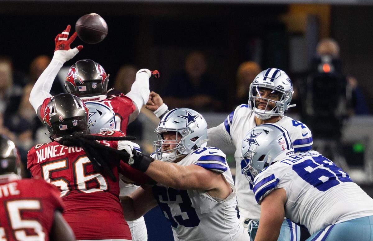 Dallas Cowboys Dak Prescott is hit by Tampa Bay Buccaneers Shaquil Barrett while throwing the ball in the second half of the game Sunday, Sept. 11, 2022, at AT&T Stadium in Arlington.