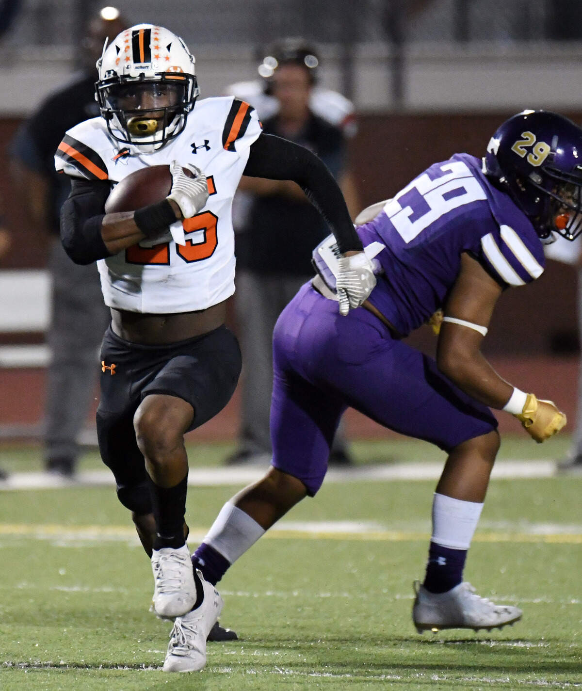 Haltom’s Devan Ramirez Powell, left finds the open field past Chisholm Trail’s Pale Uli to run for a first down during the second quarter of their district 3-6A football game Friday, September 17, 2021 at Chisholm Trail High School in Saginaw, Texas. Special/Bob Haynes