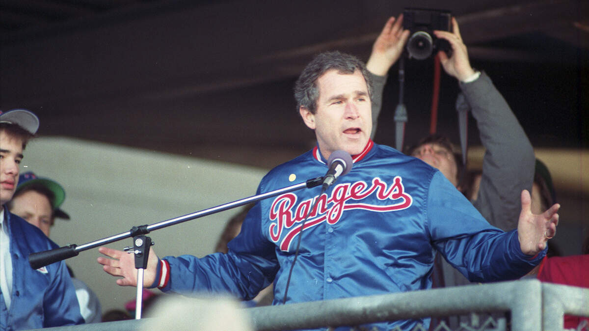George W. Bush, managing partner of the Texas Rangers baseball team from 1989 to 1994, is pictured speaking at the old Arlington Stadium in January 1991.