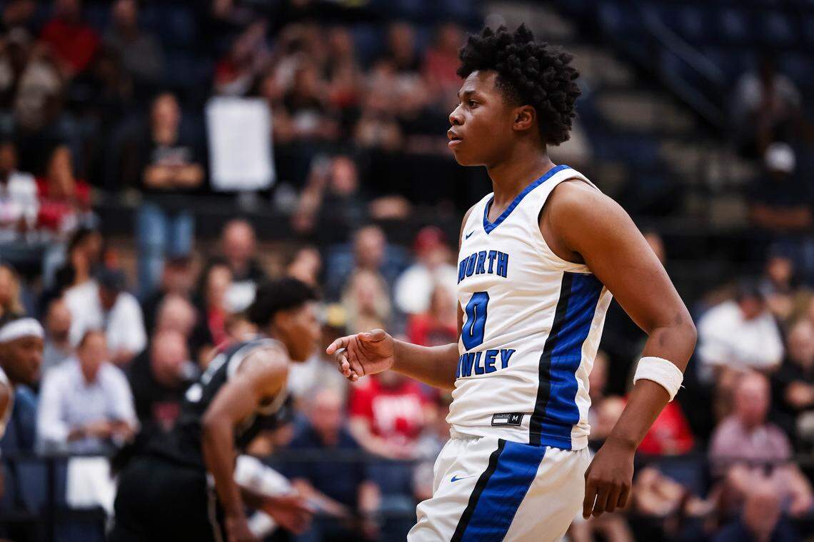 North Crowley guard Bennjamin Jones (0) points his finger out after making a 3-pointer in a UIL 6A D1 regional semifinal at Timberview High School in Arlington, Texas, Tuesday, March 3, 2026.