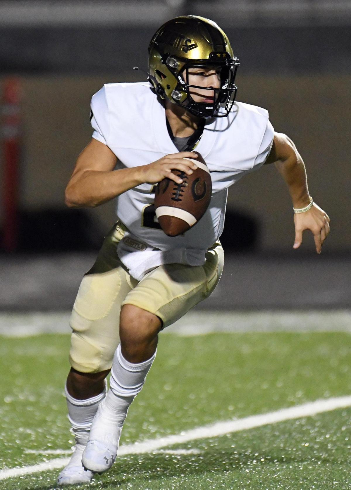 Cleburne quarterback Gunner Hammond scrambles out of the backfield agianst Weatherford in the first quarter of their football game Friday, October 9, 2020 at Kangaroo Stadium in Weatherford, Texas. Special/Bob Haynes