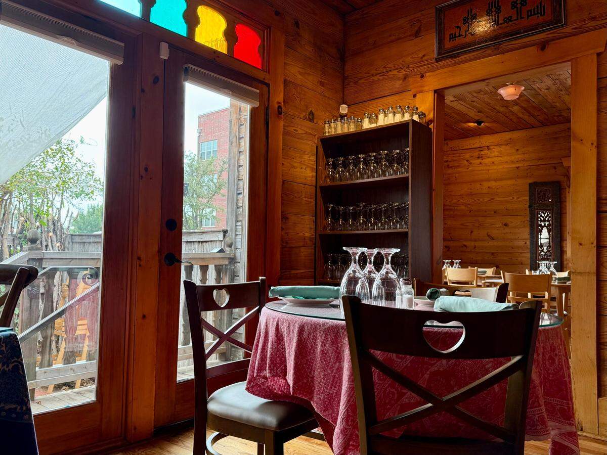 The Flying Carpet Fort Worth Turkish restaurant is in an early-20th-century wood-paneled cottage off West Magnolia Avenue.